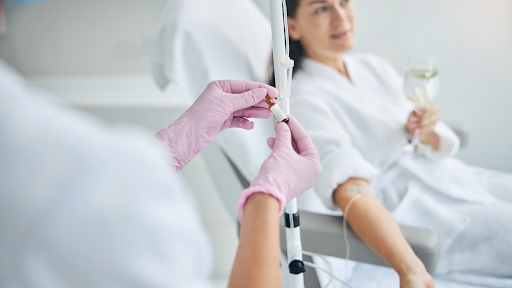 Woman receiving IV therapy infusion for hydration and wellness support